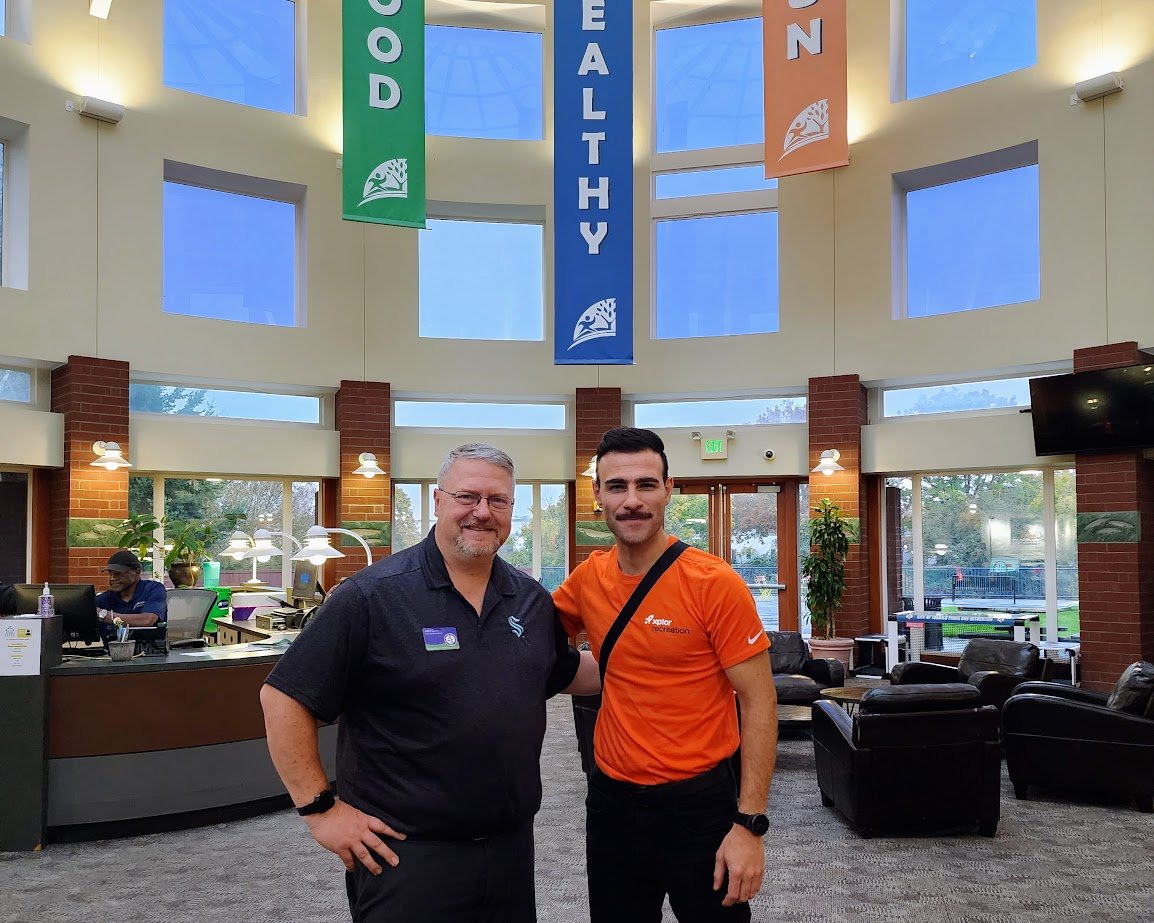 John Dunn III Recreation Superintendent at City of Tukwila with an nextRec staff member at Tukwila community center