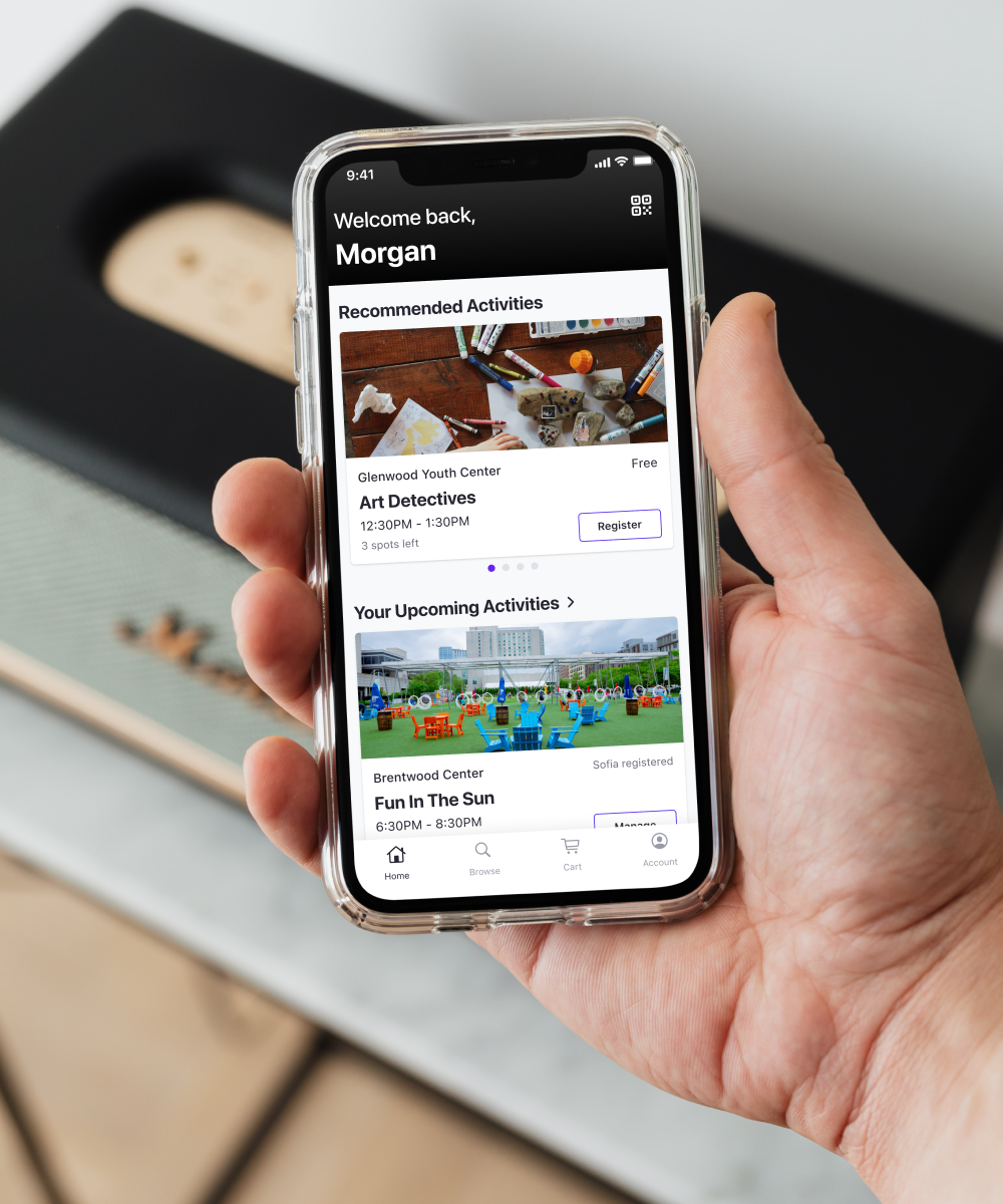image of a community member using holding their mobile phone with the nextRec mobile app loaded